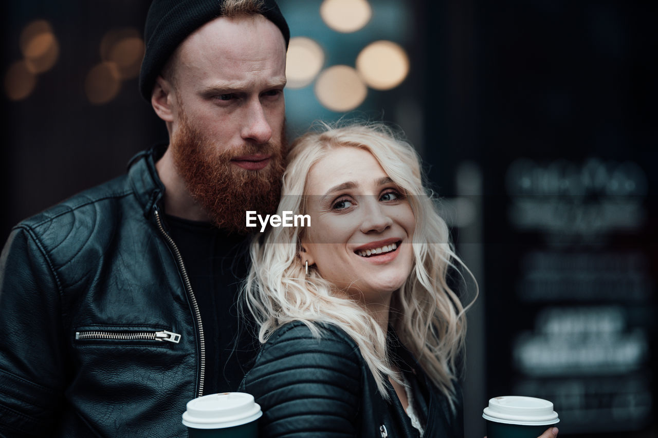 Portrait of young couple with coffee