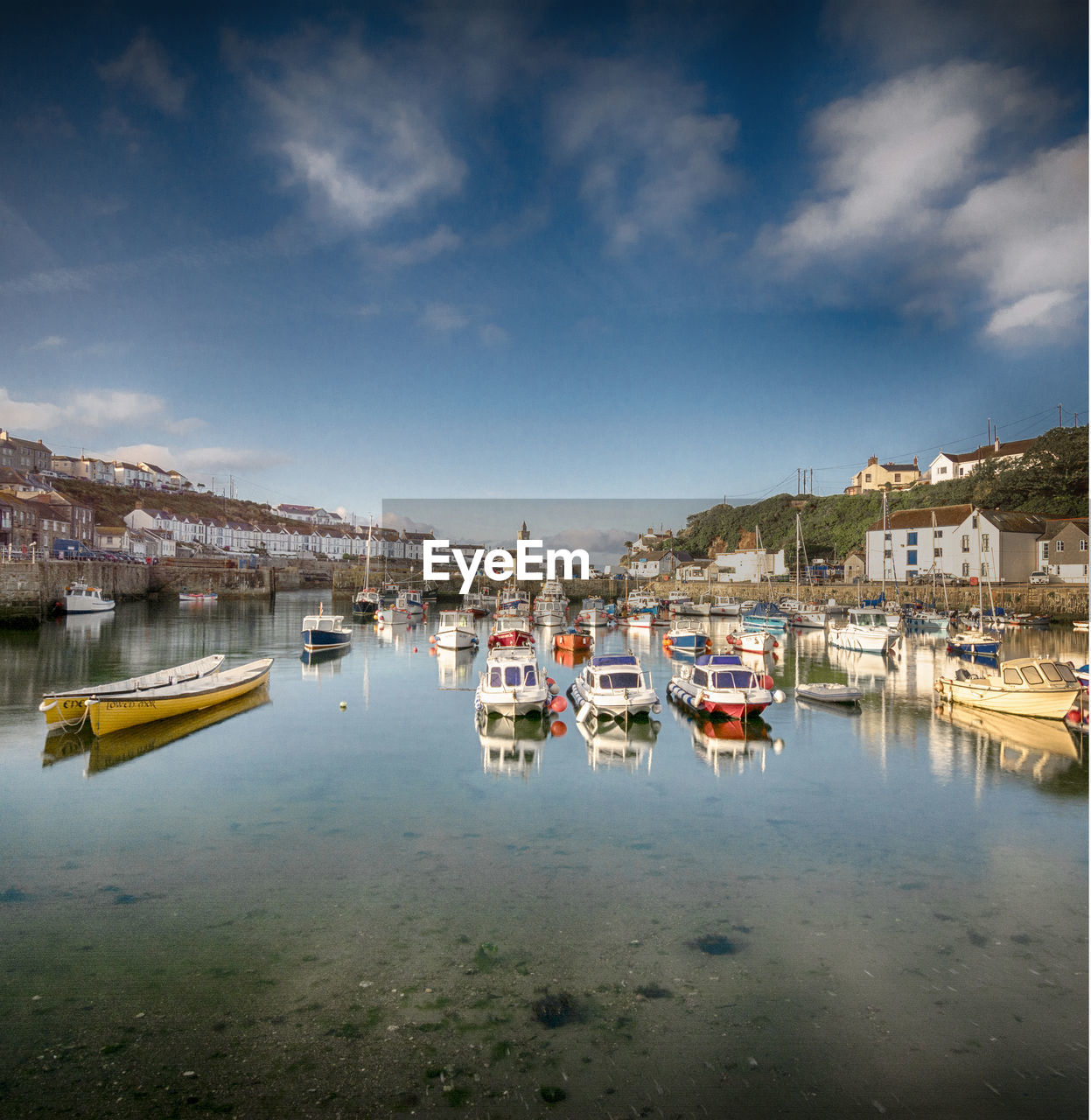 BOATS MOORED IN HARBOR