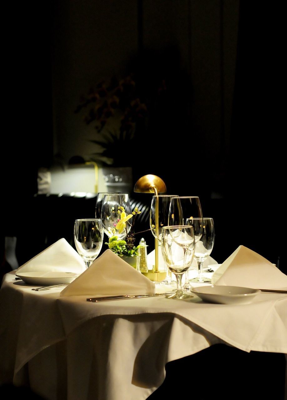 Wineglasses arranged on table at restaurant