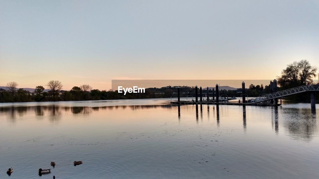 SCENIC VIEW OF LAKE AGAINST CLEAR SKY