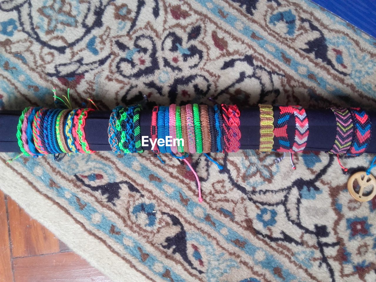 High angle view of various bracelets on wood