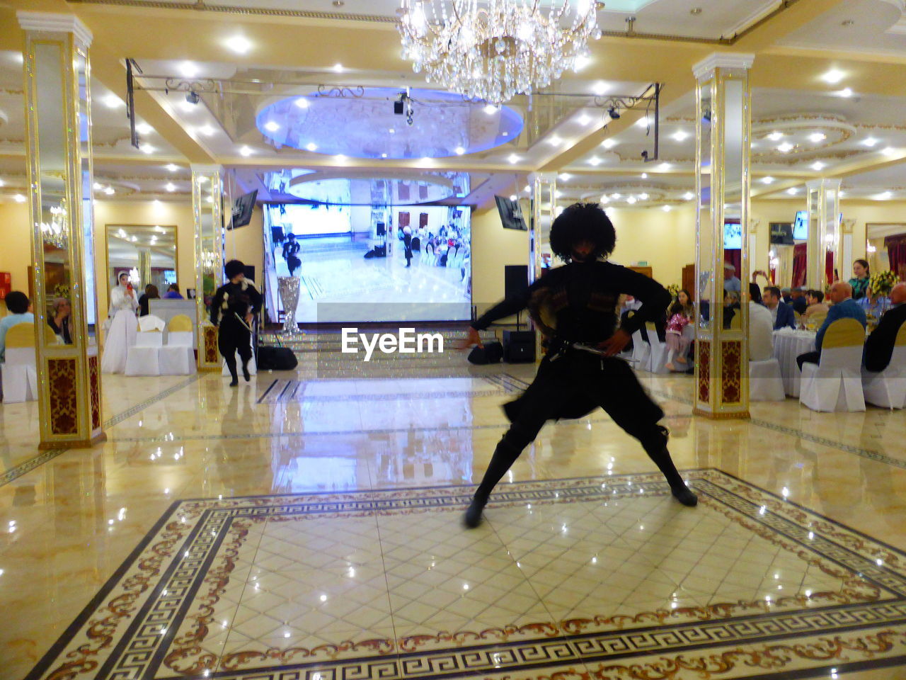 GROUP OF PEOPLE WALKING IN SHOPPING MALL