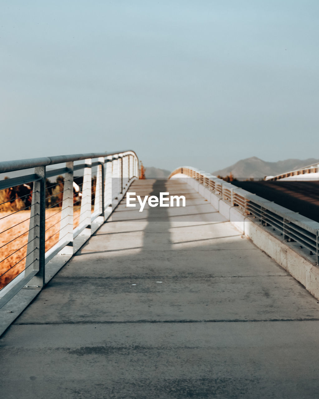 Surface level of bridge against clear sky