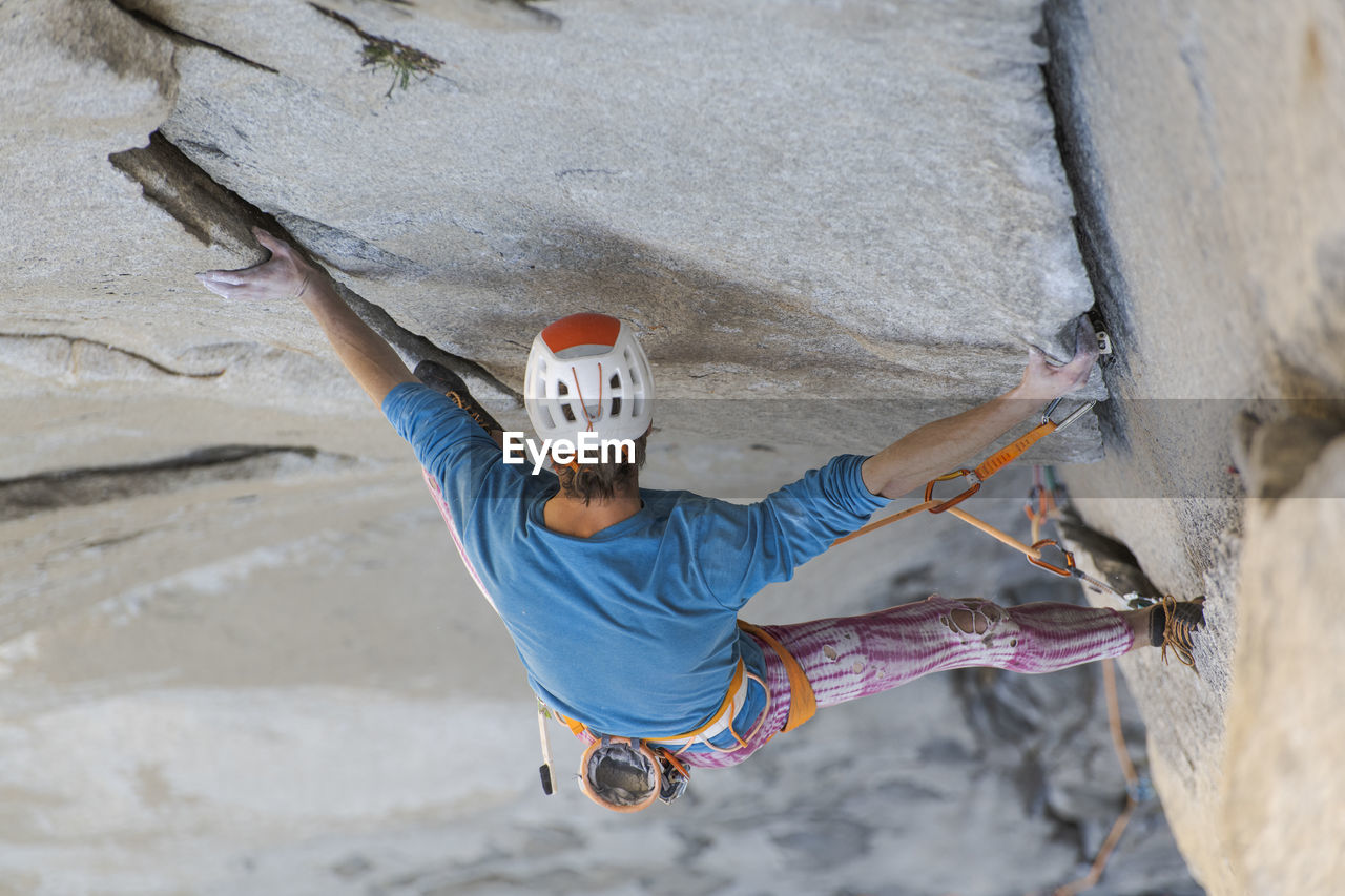 Rock climber crack climbing on the nose, el capitan in yosemite