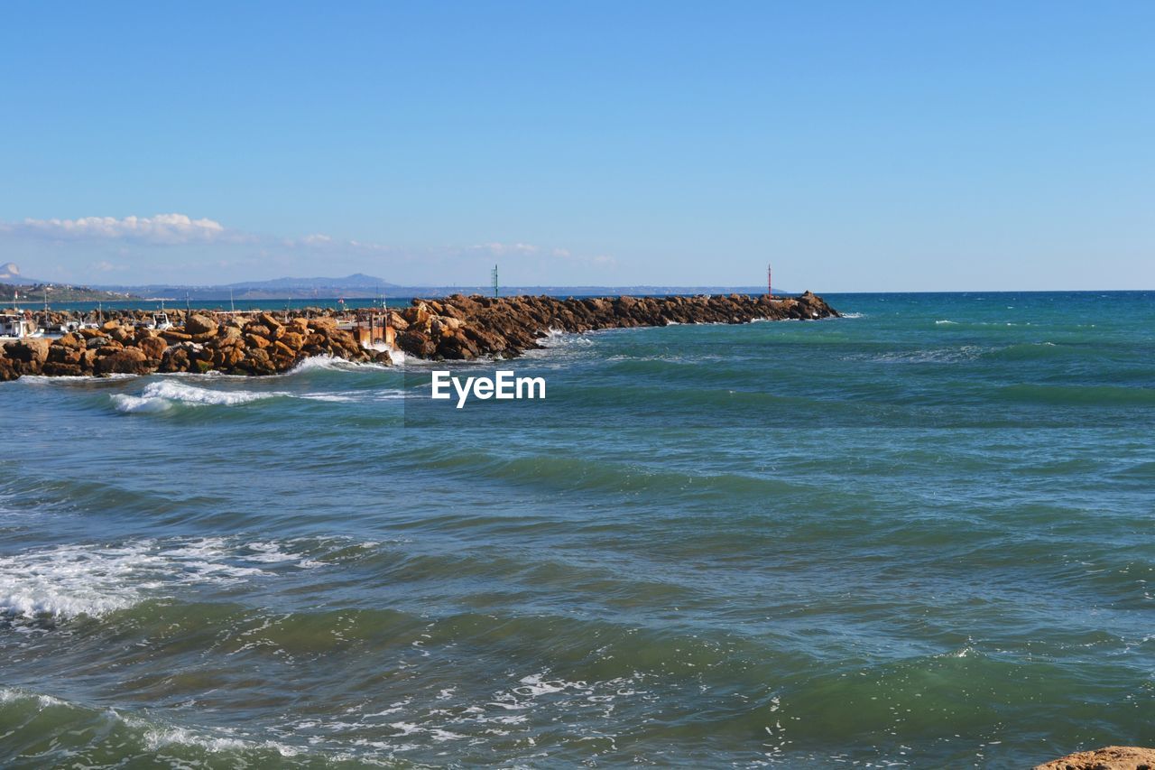 SCENIC VIEW OF SEA AGAINST CLEAR SKY