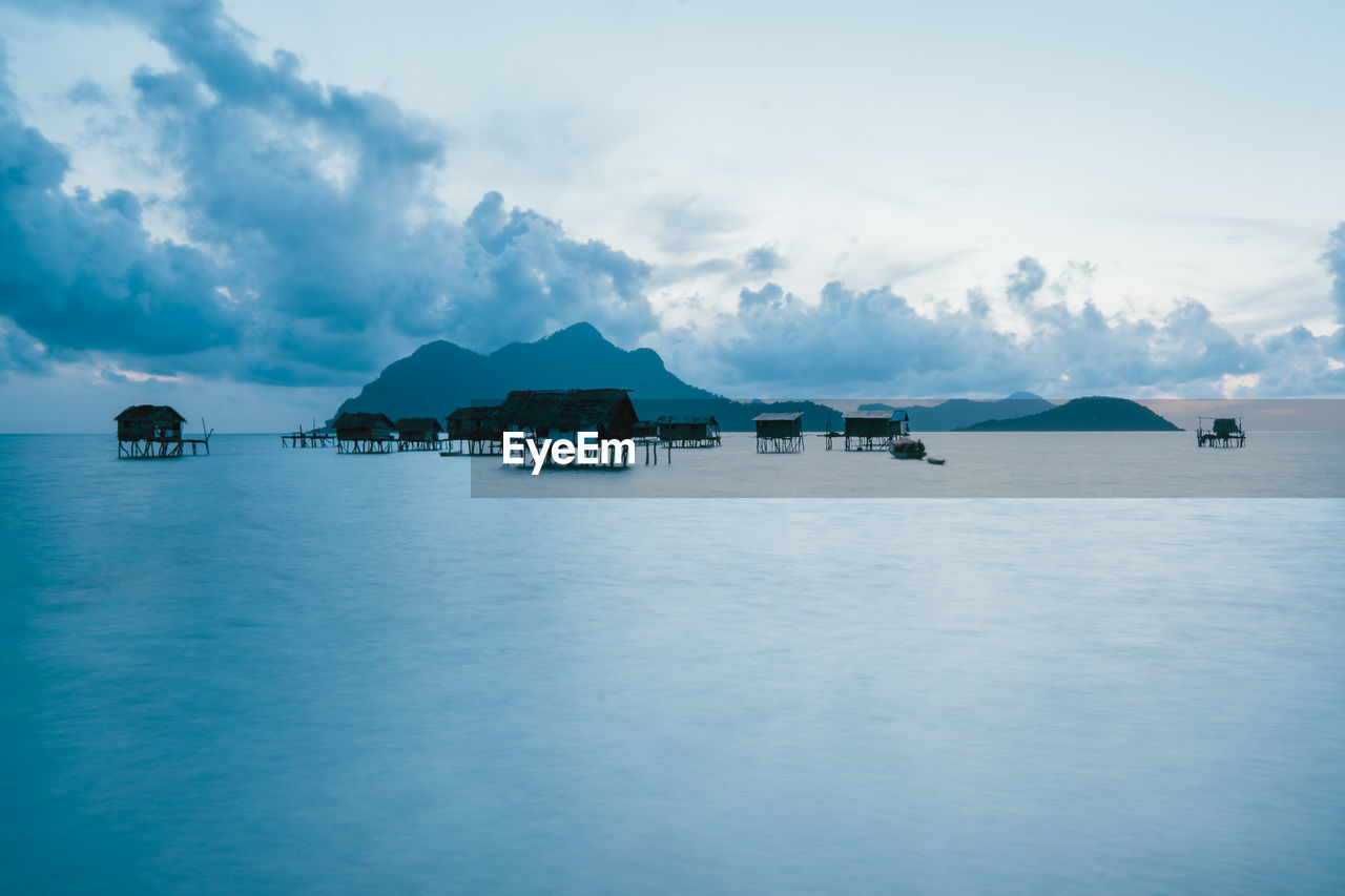 Scenic view of sea and buildings against sky