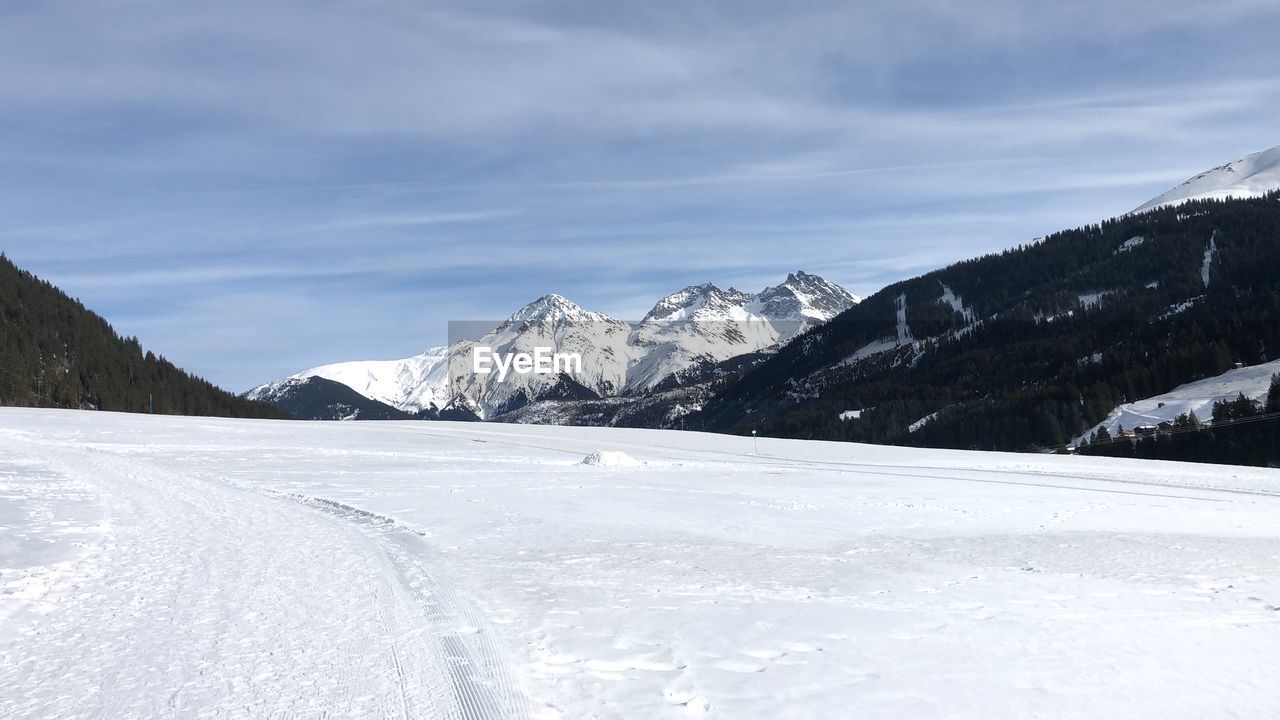 Scenic view of snowcapped mountains against sky