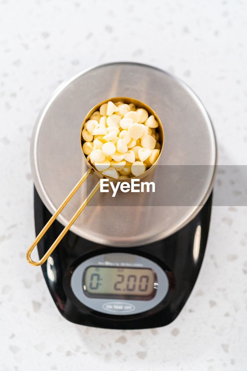 food and drink, food, indoors, healthy eating, studio shot, high angle view, popcorn, yellow, no people, wellbeing, bowl, watch, clock, close-up, snack