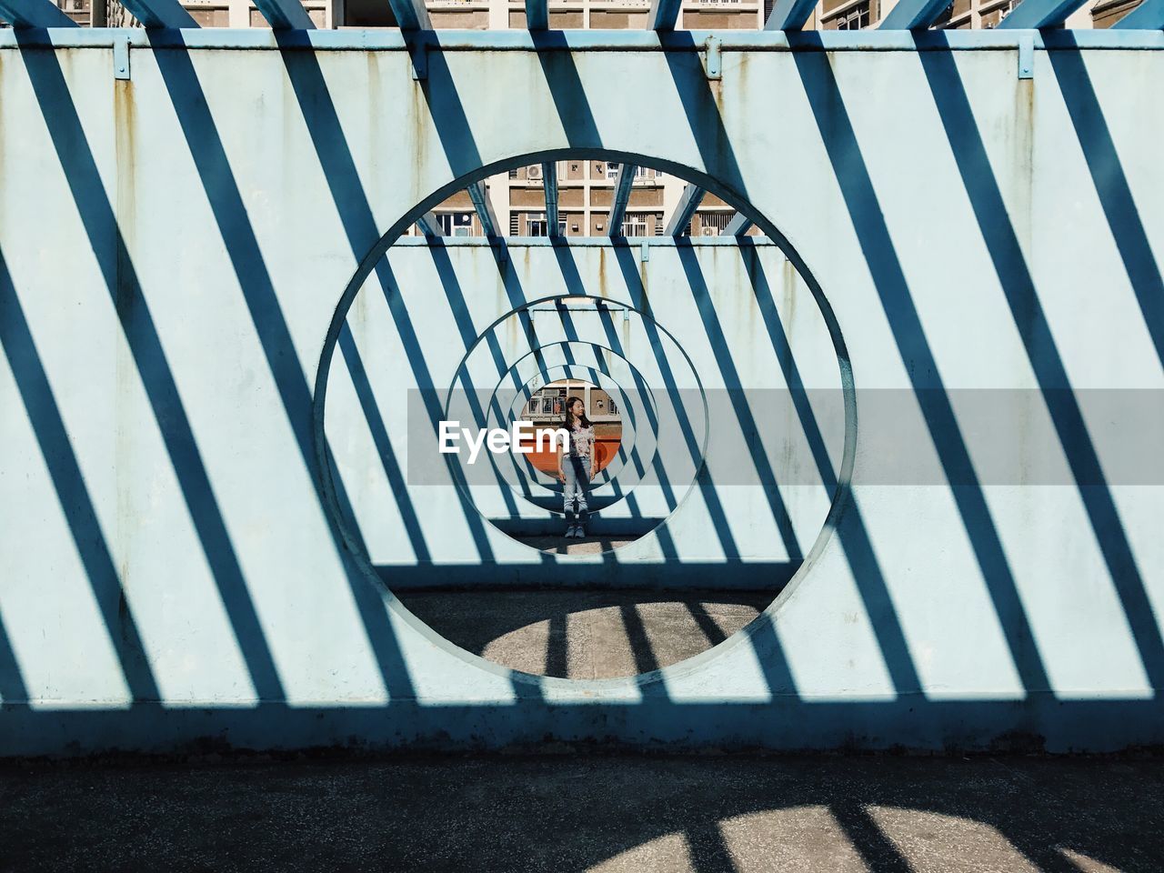 CLOSE-UP OF SHADOW HANGING ON METAL STRUCTURE