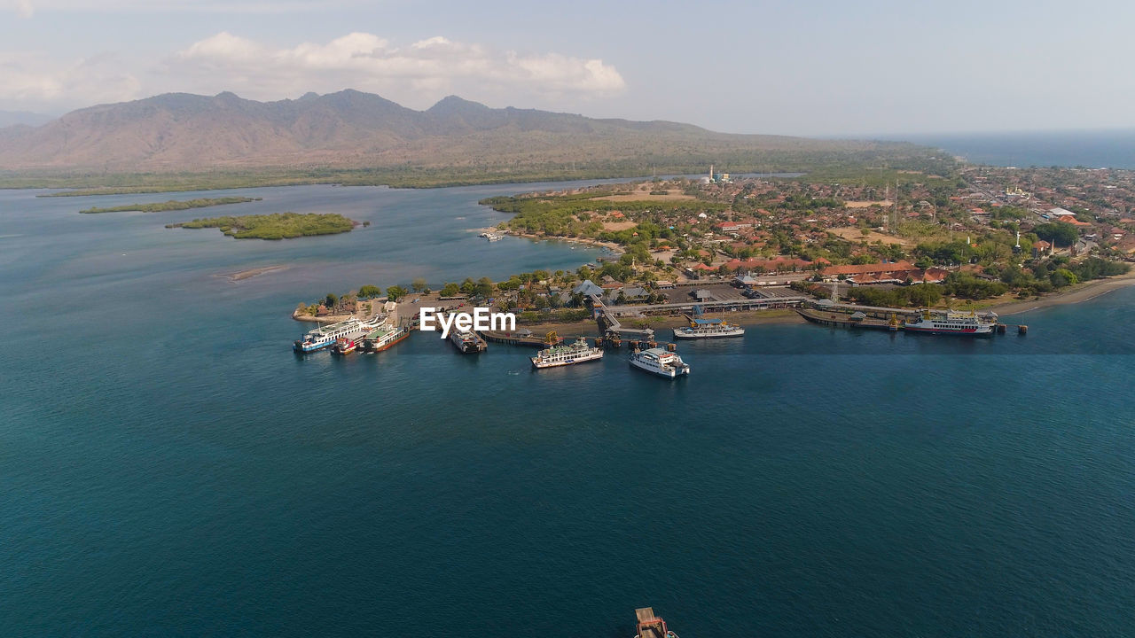 Aerial view ferry port gilimanuk with ferry boats, vehicles. 