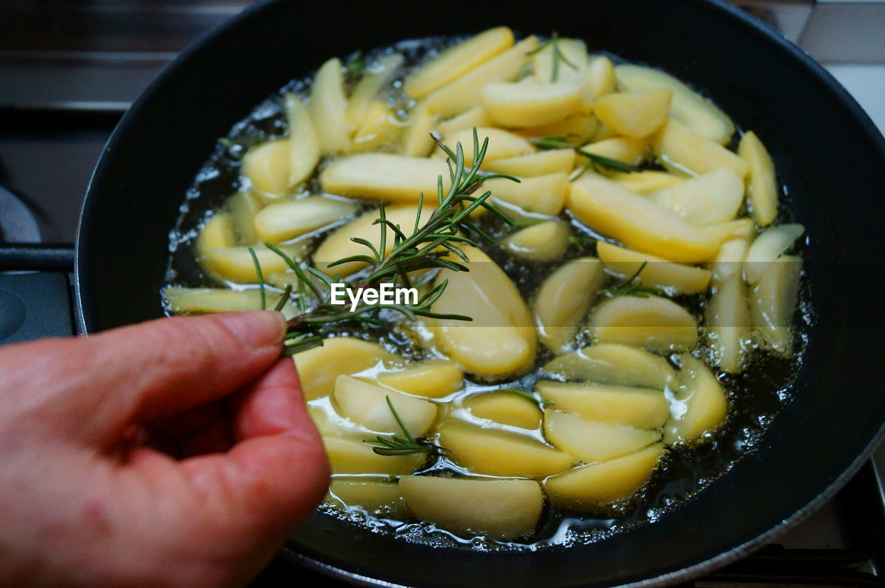 Close-up of hand preparing food