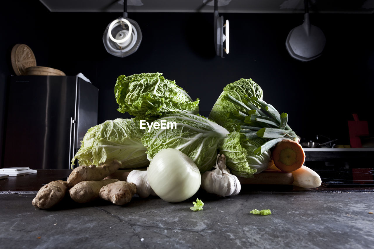 CLOSE-UP OF MEAT AND VEGETABLES ON TABLE