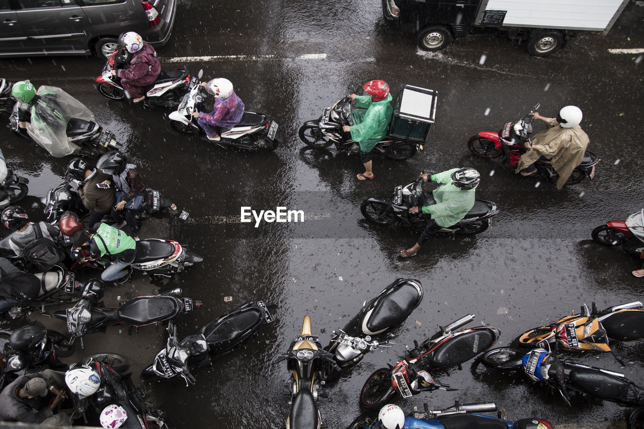 Directly above shot of people on street during rainy season