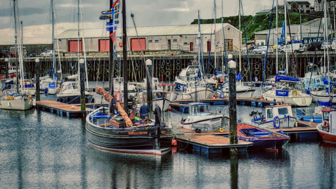 BOATS MOORED ON HARBOR