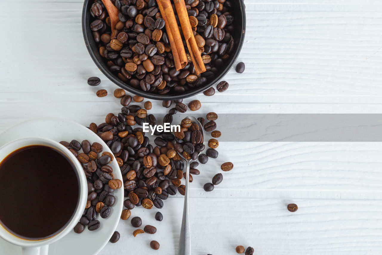 HIGH ANGLE VIEW OF COFFEE CUP AND CAKE
