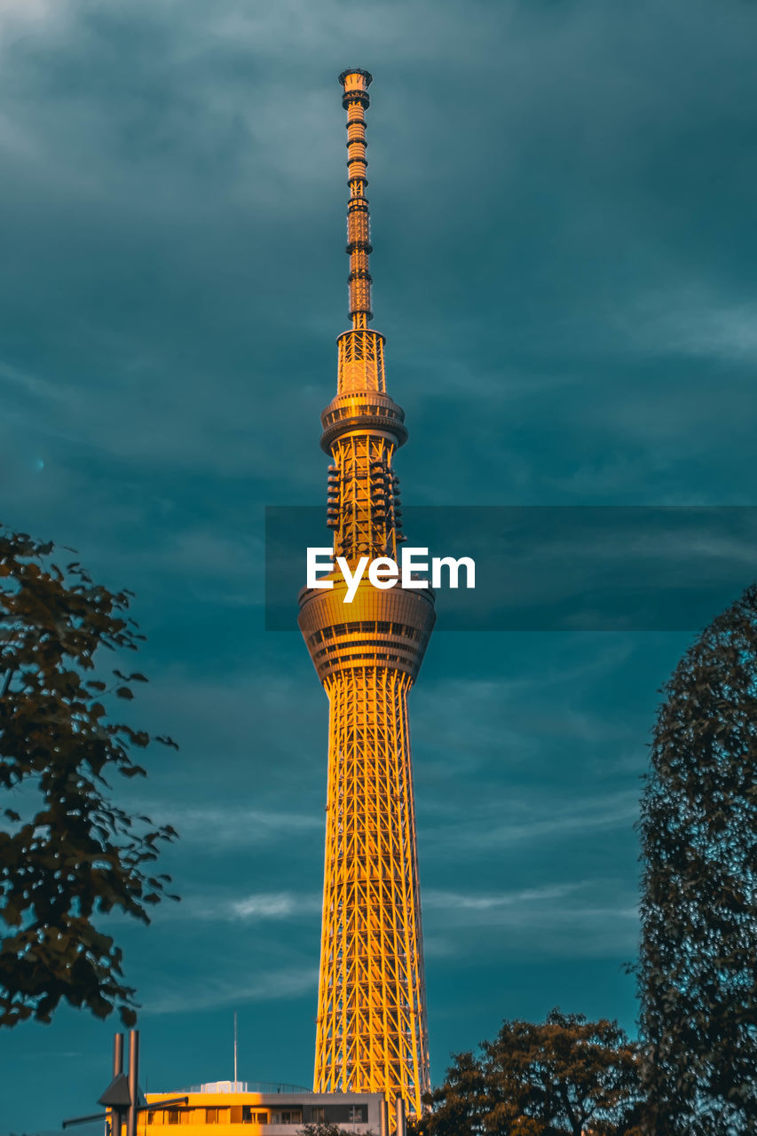 Low angle view of building against cloudy sky