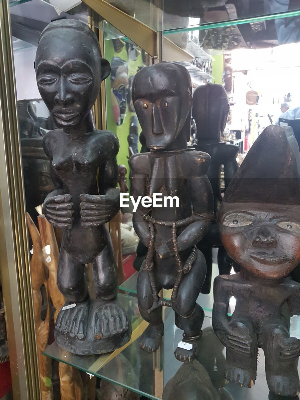 CLOSE-UP OF SCULPTURES IN STORE