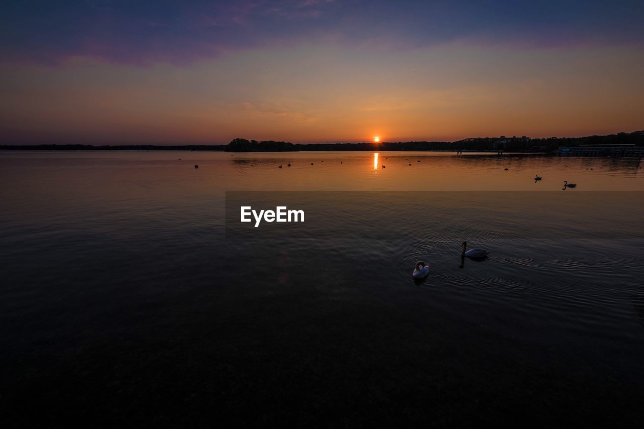 Scenic view of sunset over river