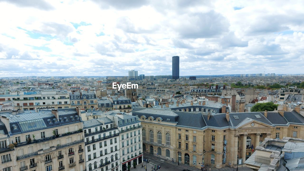 architecture, built structure, city, building exterior, cityscape, urban area, building, sky, cloud, skyline, landmark, downtown, metropolis, travel destinations, skyscraper, metropolitan area, urban skyline, town, residential district, high angle view, nature, tower block, neighbourhood, landscape, city life, travel, crowd, residential area, tourism, aerial photography, outdoors, day, tower, office building exterior, crowded, street, aerial view, history, the past, roof, horizon