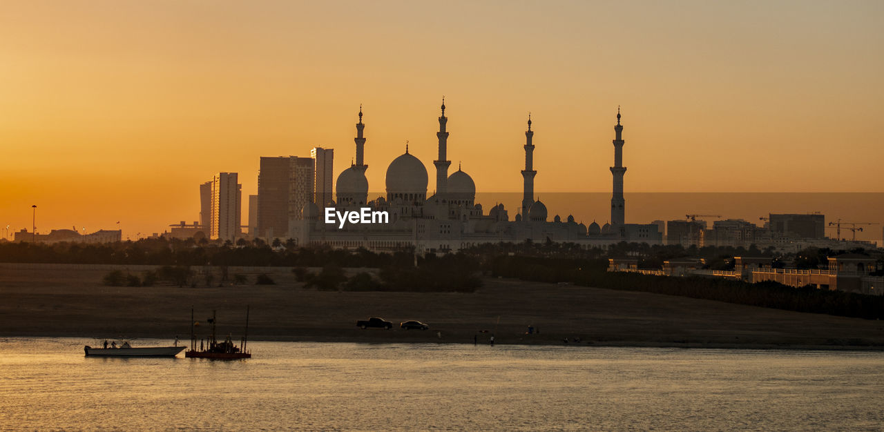 VIEW OF BUILDINGS AGAINST SKY DURING SUNSET