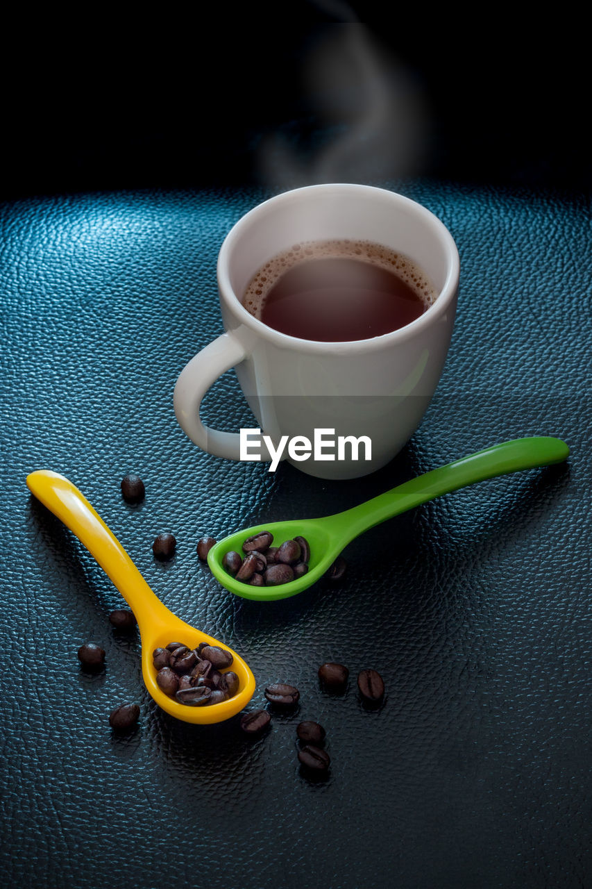 High angle view of coffee cup on table