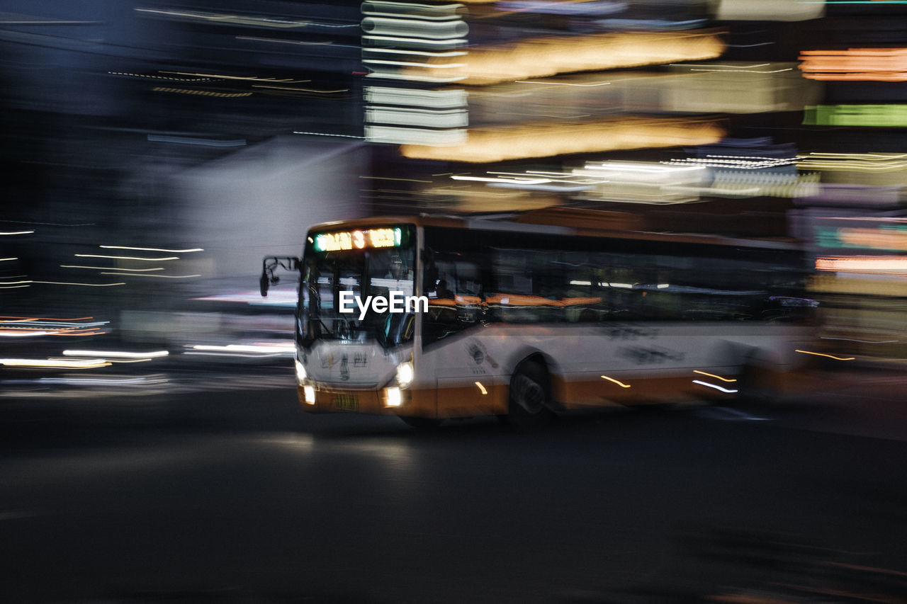 Blurred motion of car on road at night