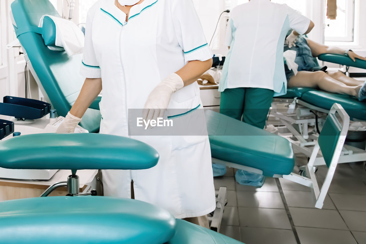 Midsection of nurse at blood donation camp