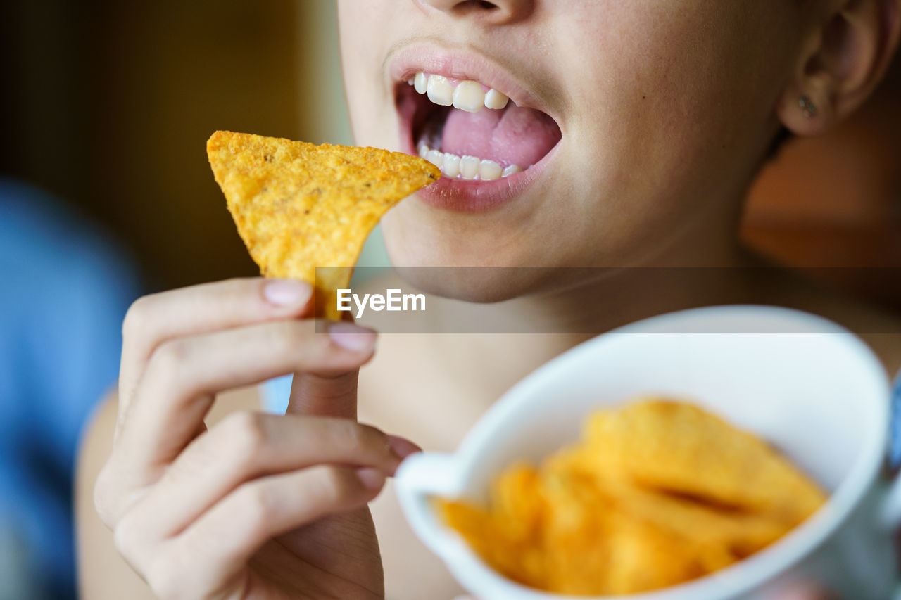 cropped image of woman holding food