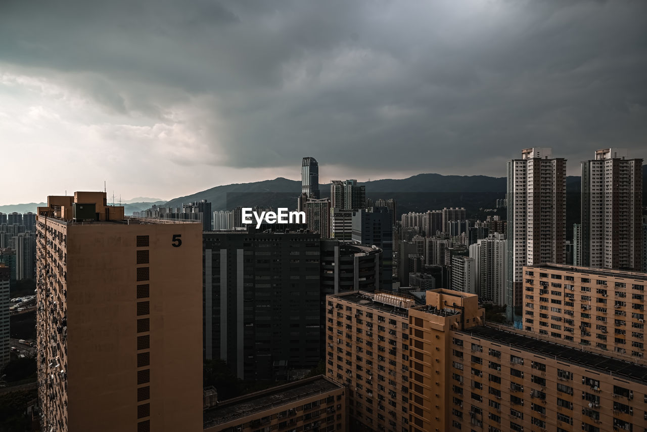 High angle view of buildings in city against sky