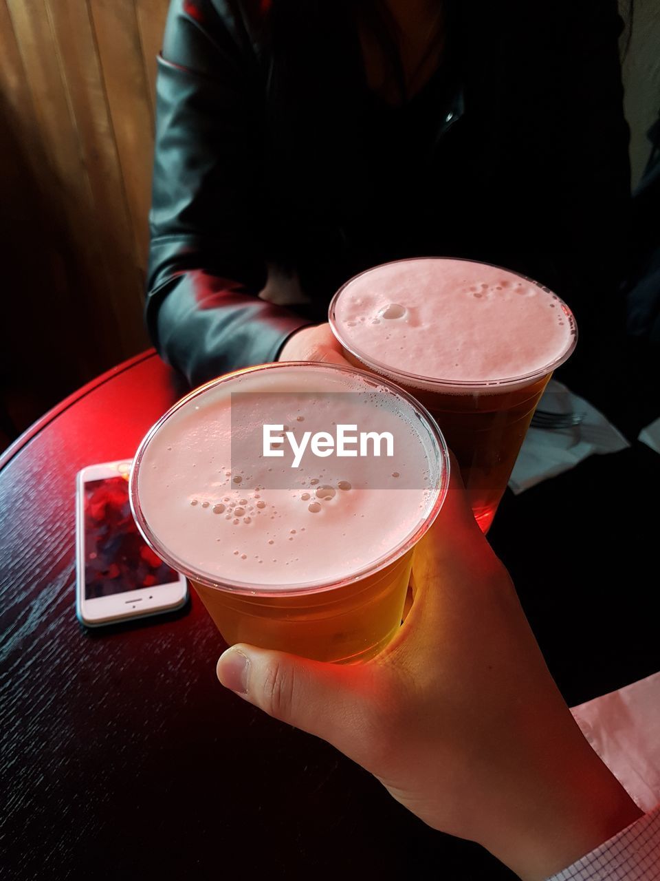 MIDSECTION OF PERSON WITH DRINK IN GLASS