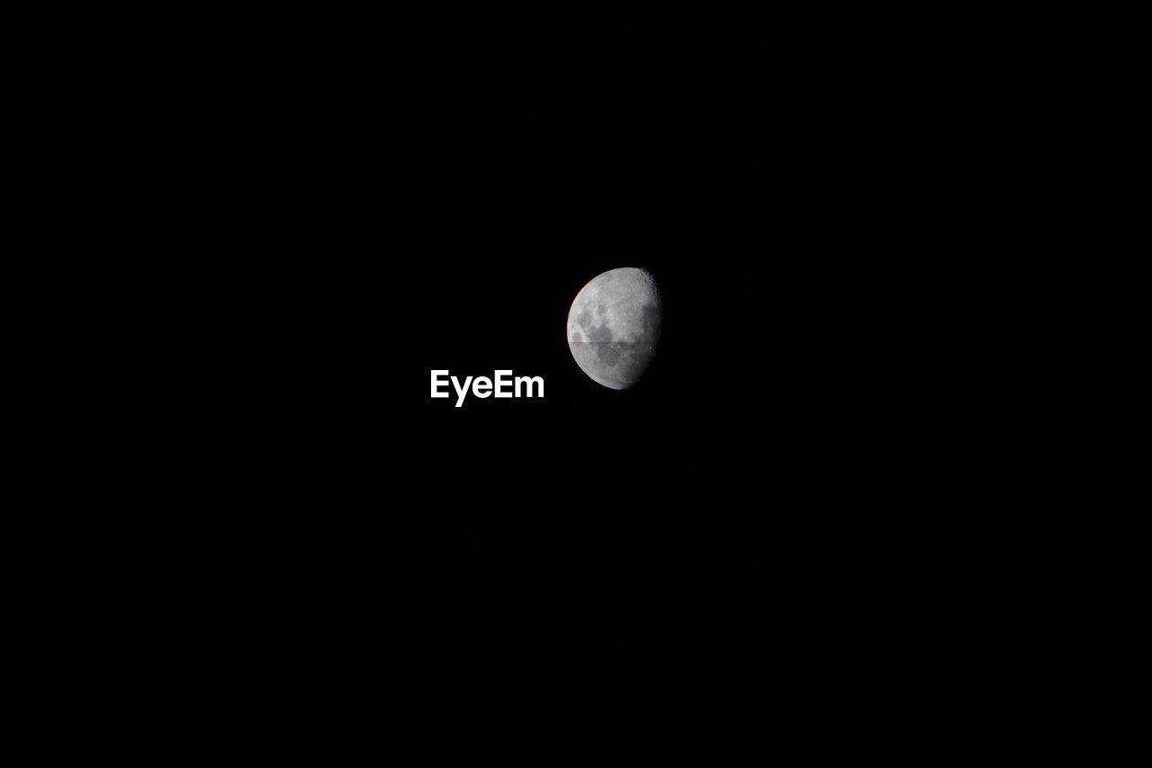 Low angle view of moon in clear sky at night