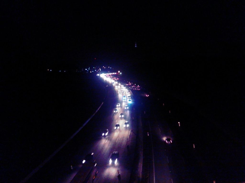 ROAD PASSING THROUGH ILLUMINATED TUNNEL