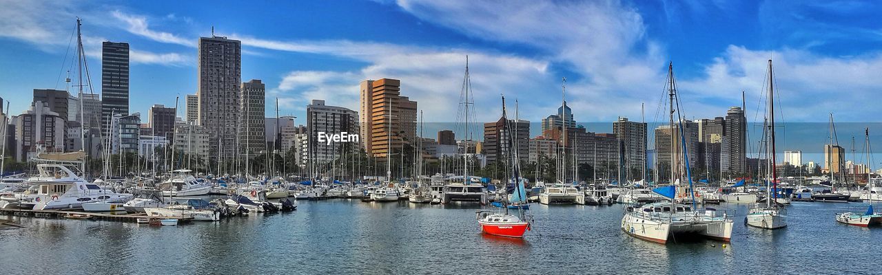 Modern cityscape emerging over water's edge