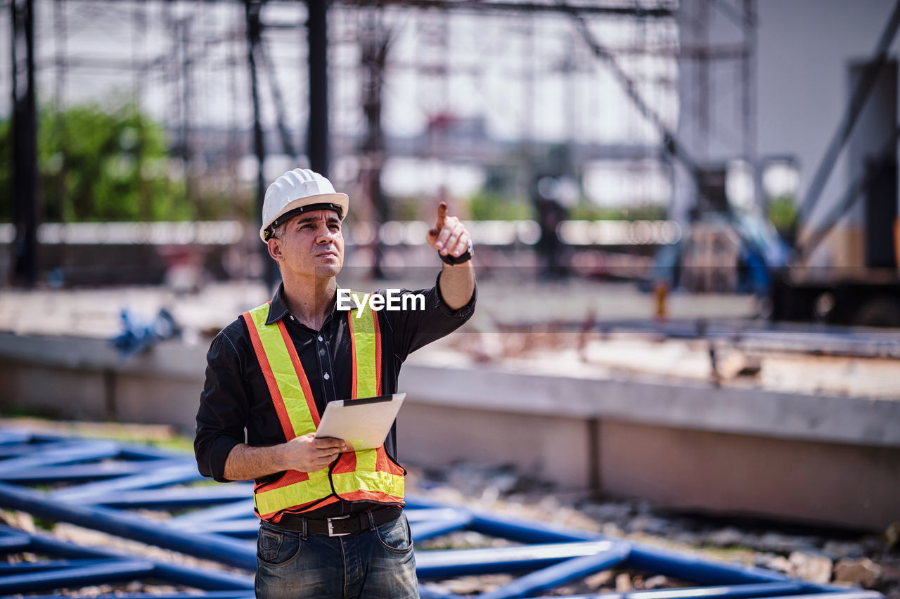 Portrait of man working at construction site