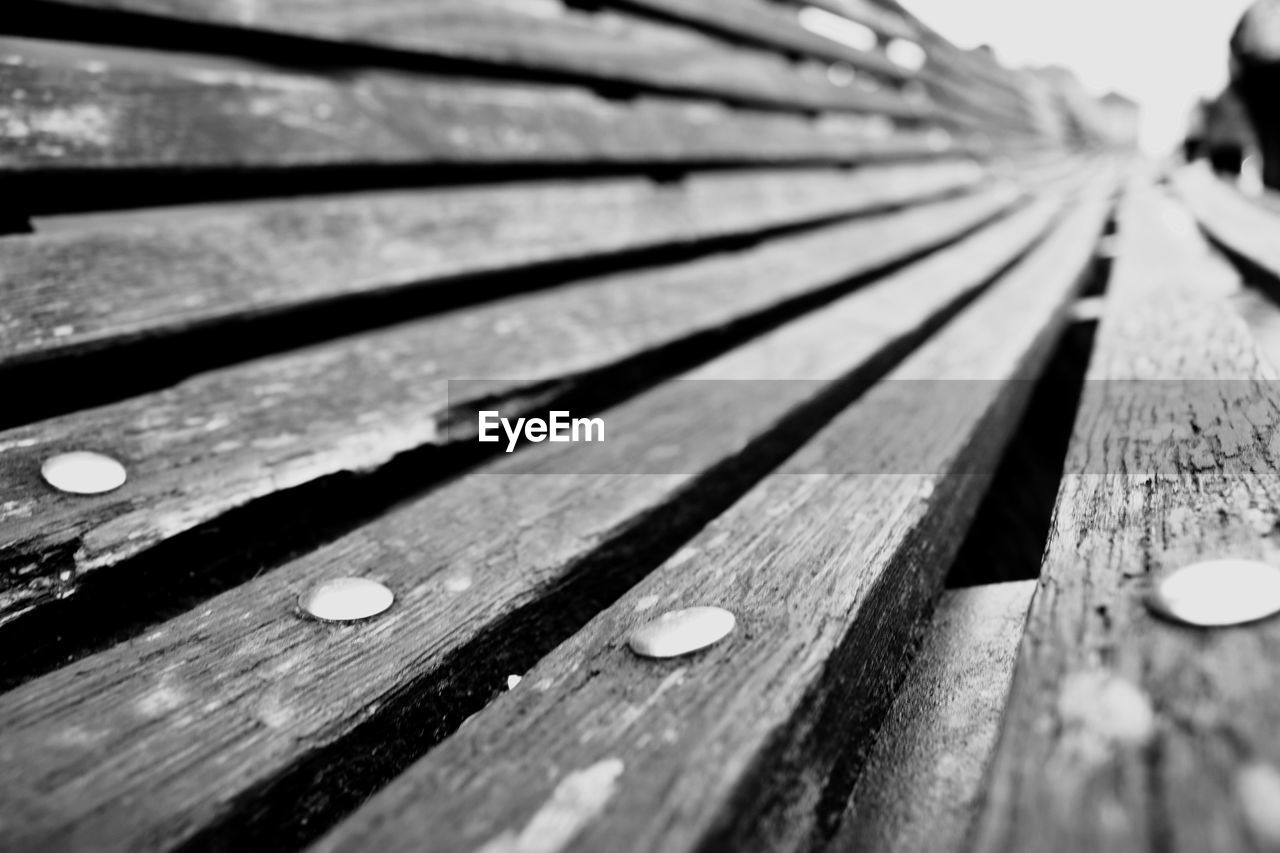 FULL FRAME SHOT OF WOOD WITH BENCH