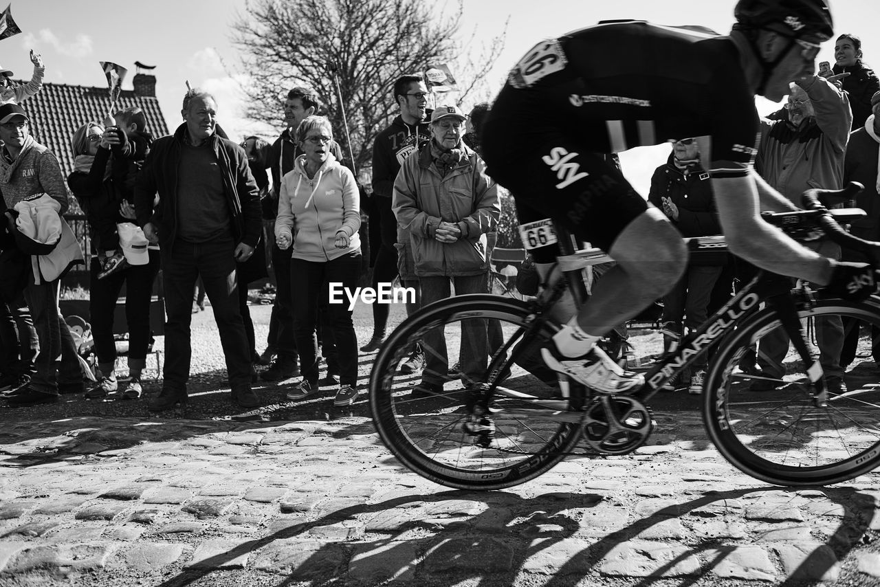 PERSON RIDING BICYCLE ON ROAD