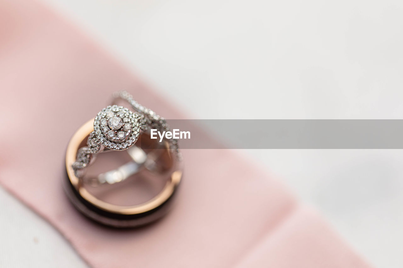ring, jewelry, wedding, wedding ring, diamond, love, engagement ring, diamond ring, event, celebration, fashion accessory, life events, luxury, wealth, positive emotion, emotion, engagement, romance, married, copy space, jewellery, close-up, gemstone, platinum, indoors, precious gem, newlywed, gold, pink, dedication, shiny, hand, silver, bride, two objects, selective focus, studio shot, women, wedding ceremony supply, adult, fashion, togetherness
