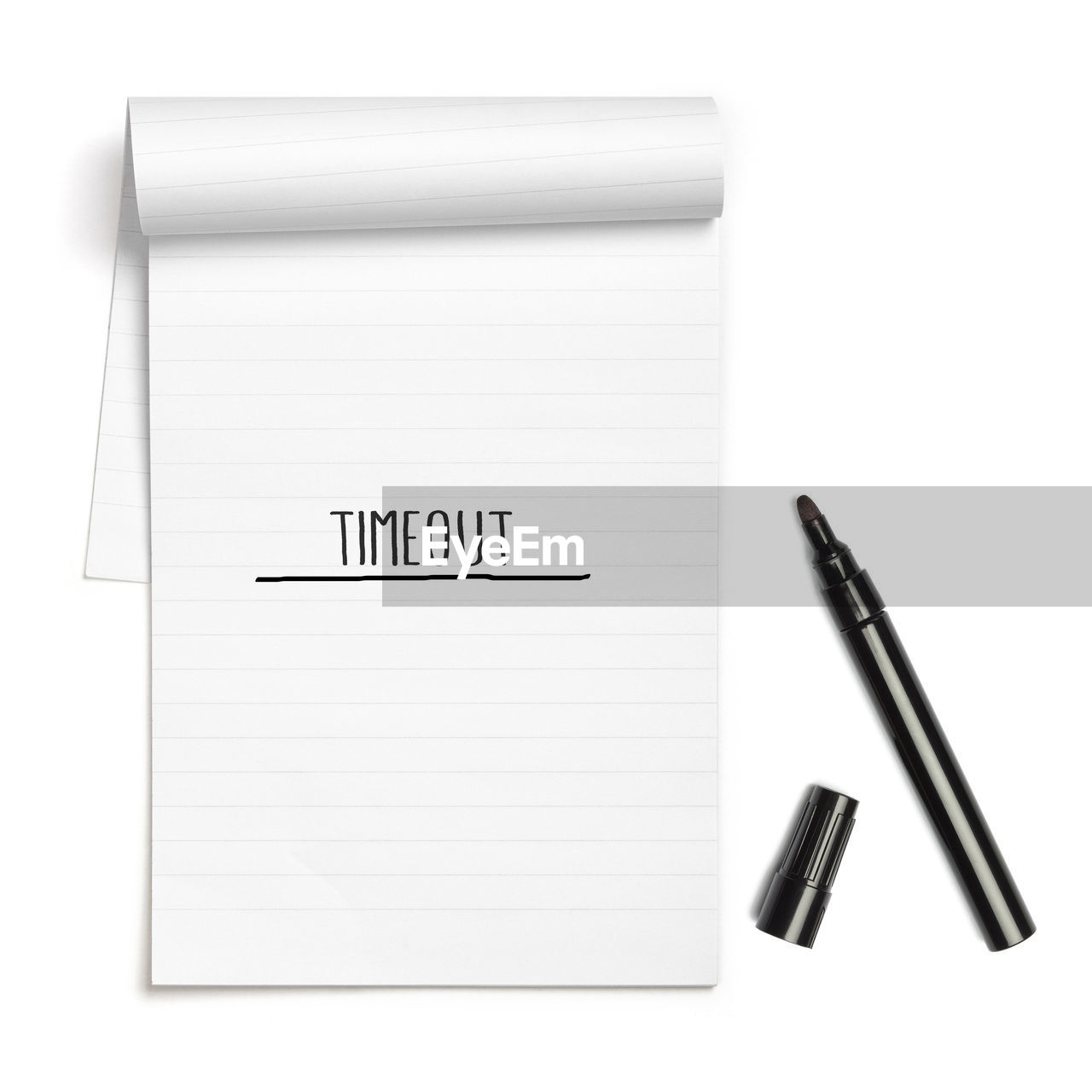 Timeout as note word in hand writing on lined paper note pad, isolated on white background