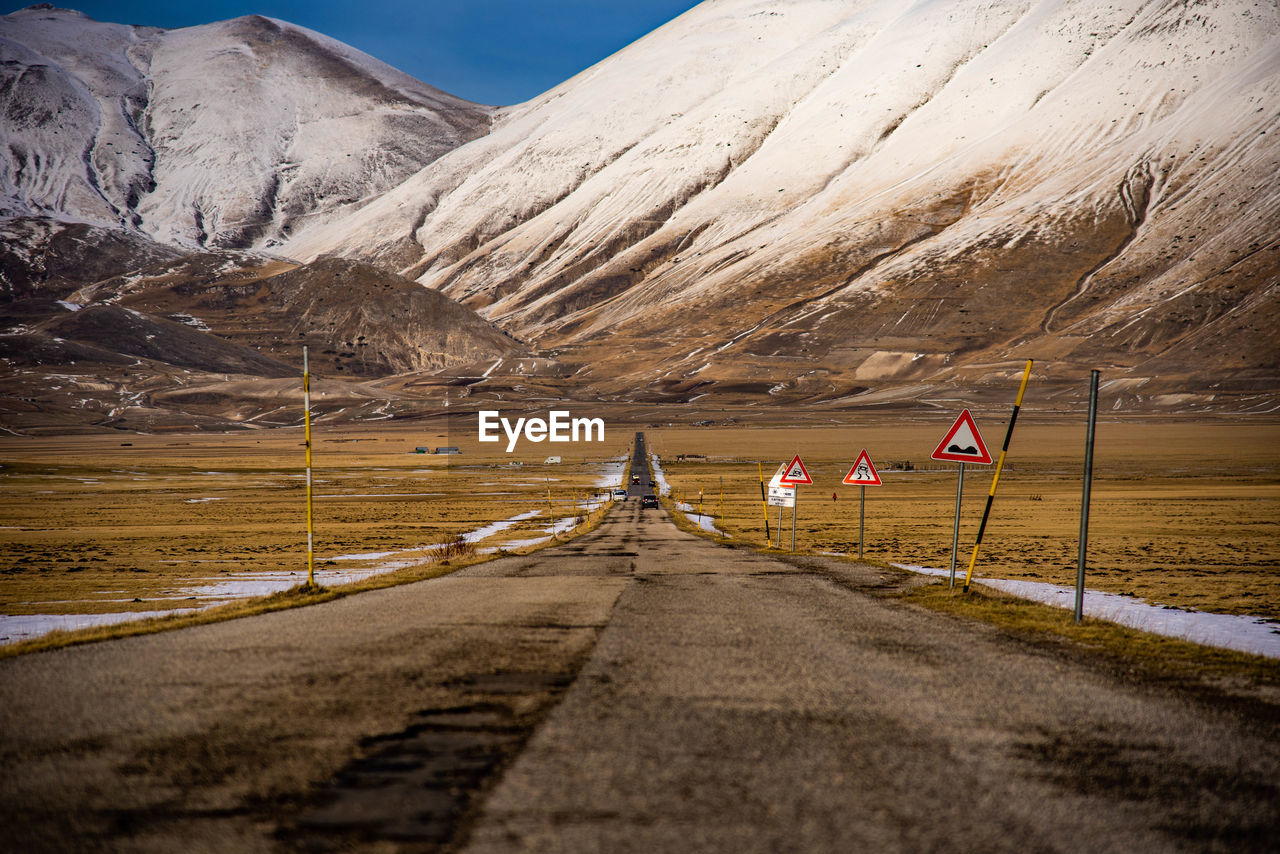 Road leading towards mountains