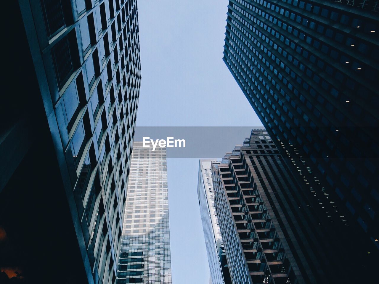 Low angle view of skyscrapers against clear sky