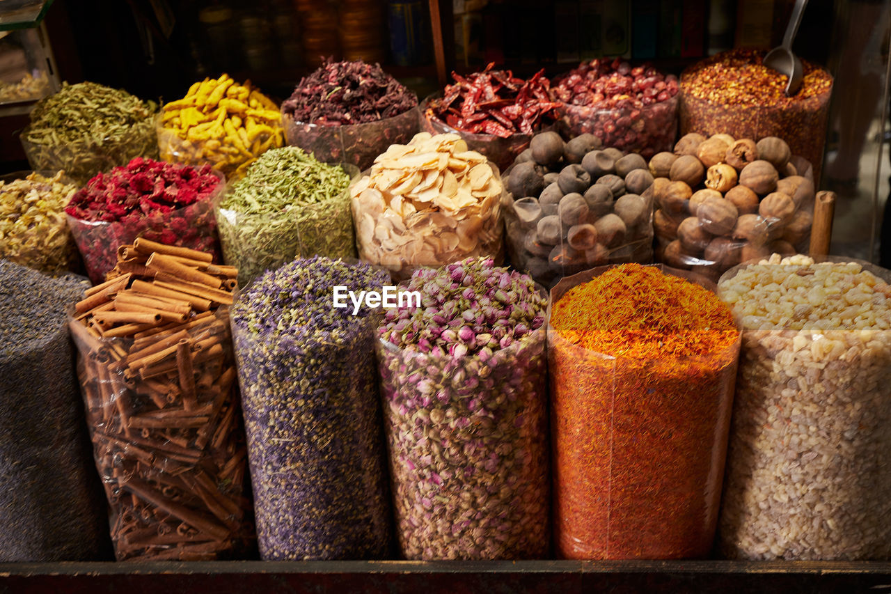 Sacks of dried spices, tea and incense at bazaar market in dubai filling the frame