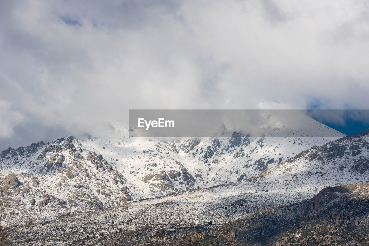 PANORAMIC SHOT OF SNOWCAPPED MOUNTAINS AGAINST SKY