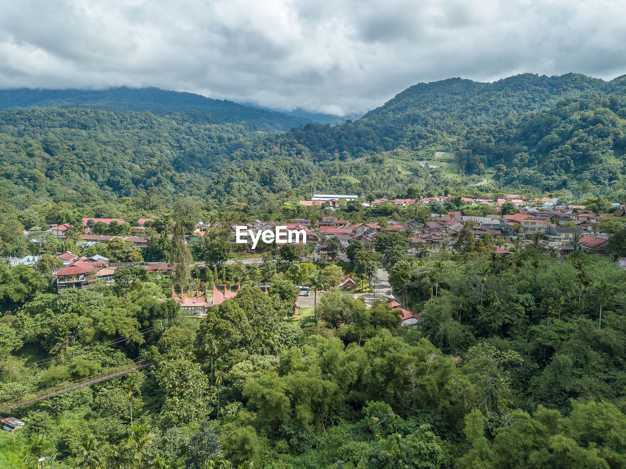 High angle view of plants and buildings against sky