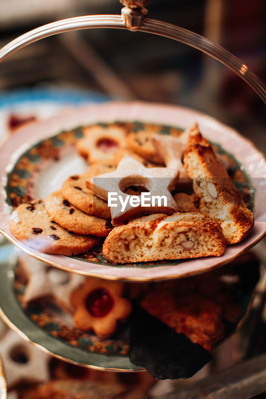 Tasty sweet cookies with almond on a plate. delicious dessert in a cafe