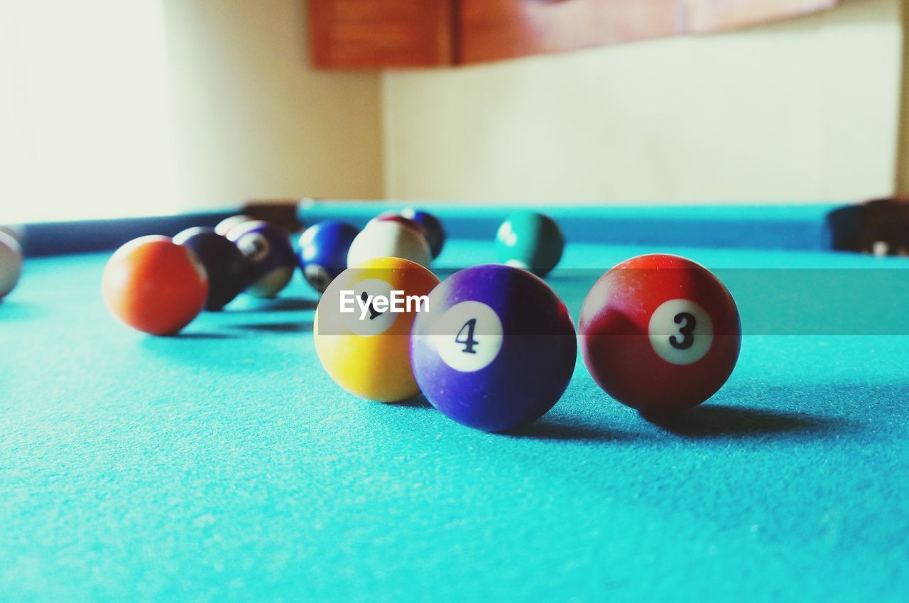 pool ball, pool table, sport, pool - cue sport, indoors, still life, snooker, snooker ball, table, focus on foreground, sports equipment, multi colored, cue ball, ball, leisure activity, no people, leisure games, competition, close-up, pool cue, snooker and pool, day