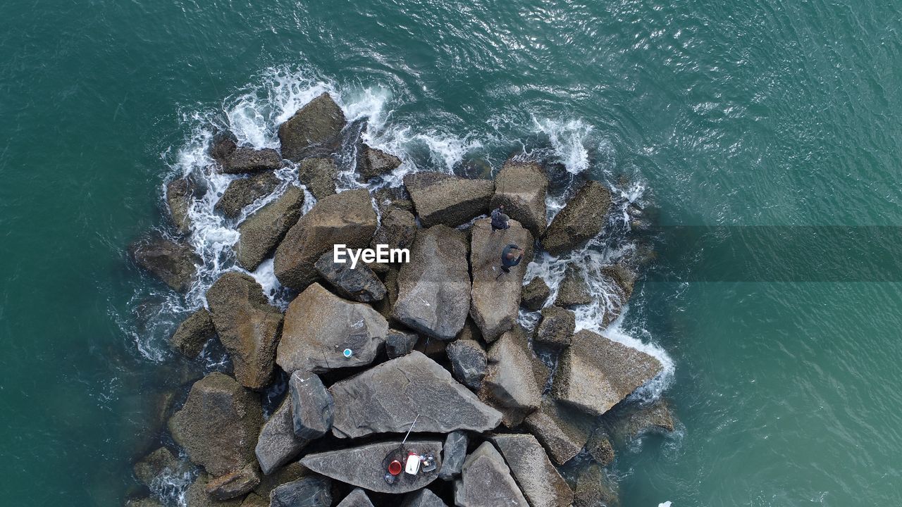 High angle view of rocks in sea