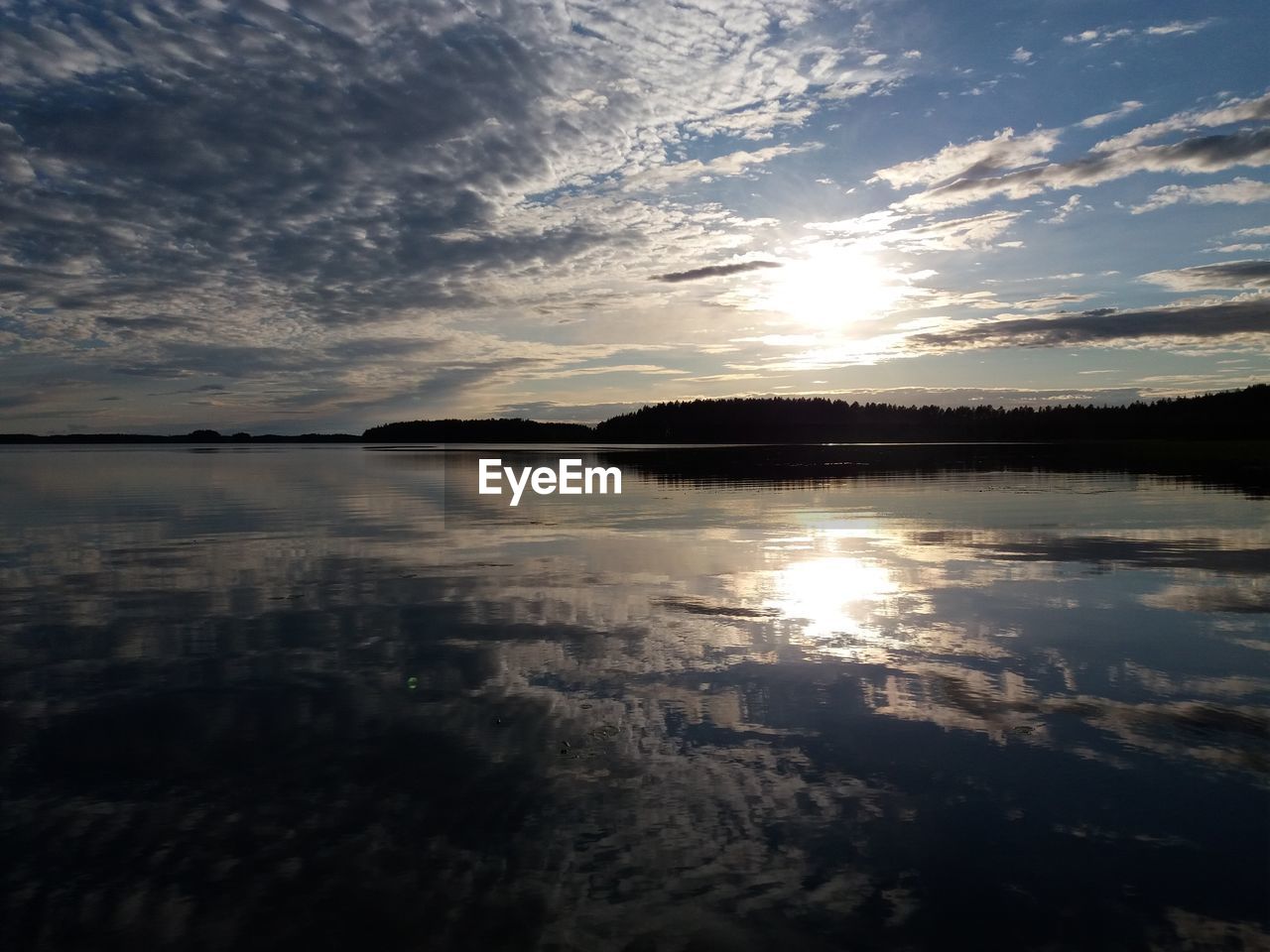 SCENIC VIEW OF SUNSET OVER LAKE