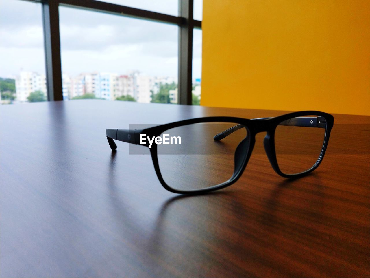 Close-up of eyeglasses on table at office