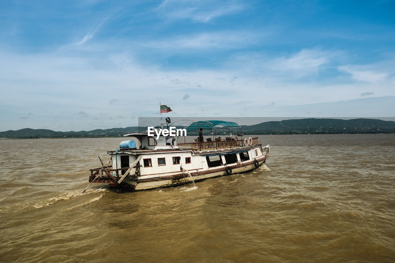 Boat in ayeyarwaddy river. mandalay. myanmar.