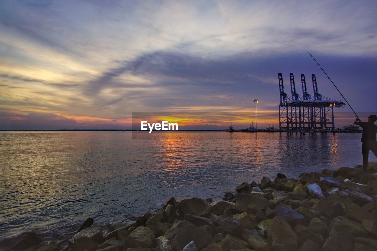 SCENIC VIEW OF SEA DURING SUNSET